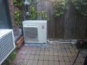 Mitsubishi outdoor unit in backyard in New York
